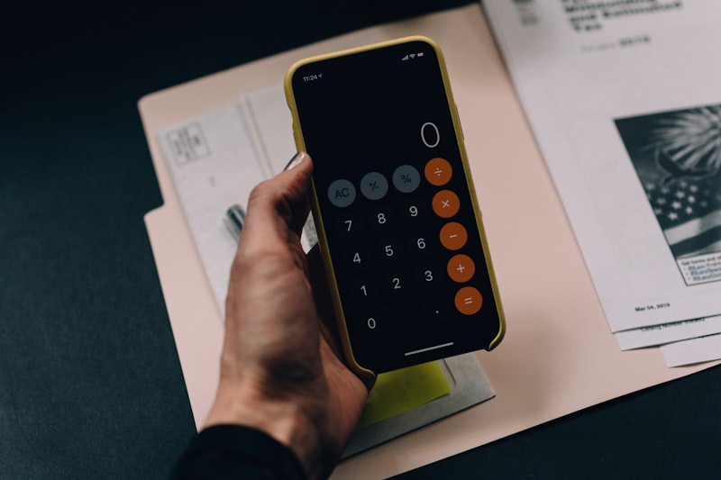 A sleek tablet displaying an educational dashboard with bar charts, sitting next to a wireless keyboard. Bright, professional top-down photography. No humans.